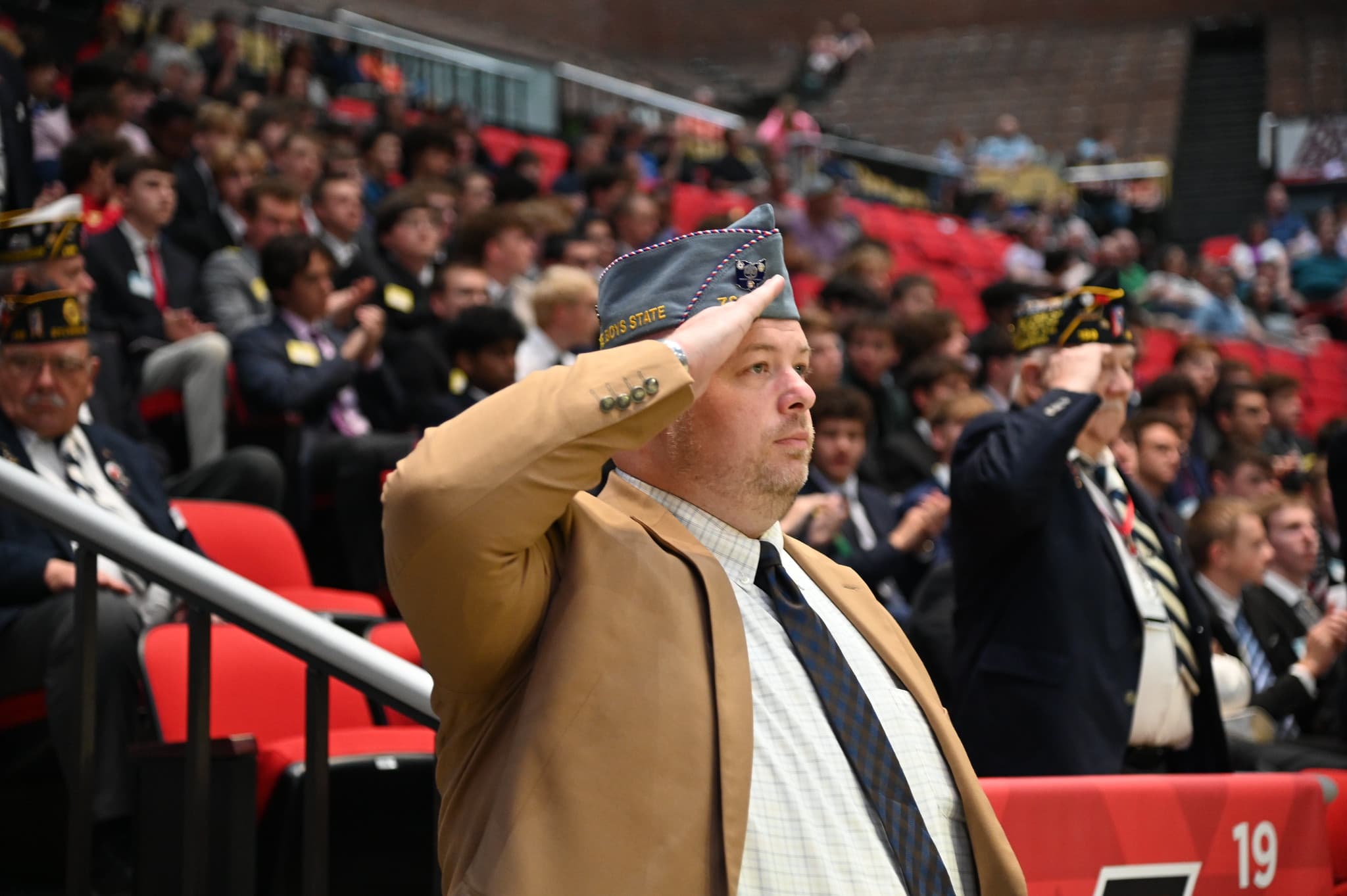 Man looking forward in reverence while saluting